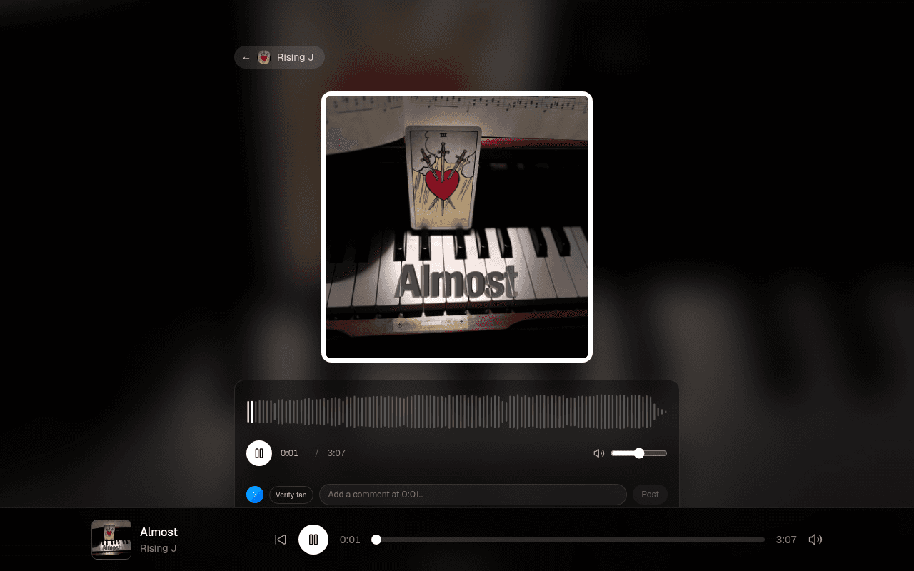 A BoomChik track page mid-play: album art, a live waveform with timestamped comments, and the player docked at the bottom of the screen